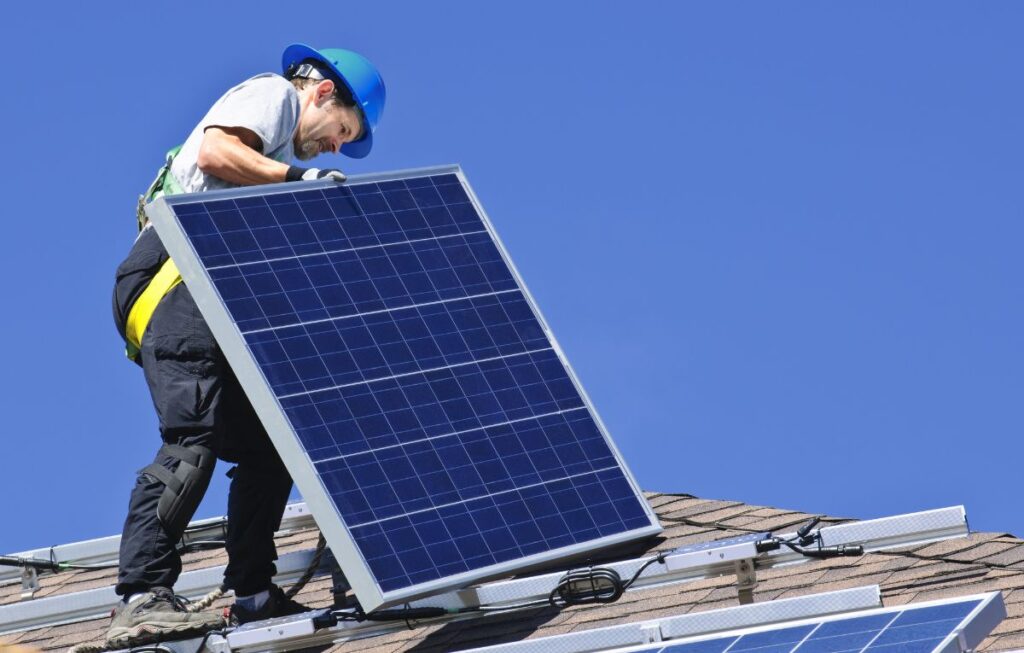 man holding a solar panel